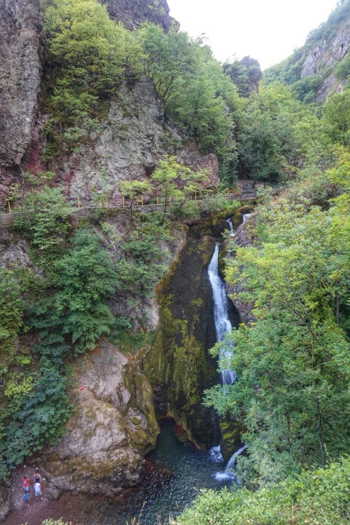 A waterfall amidst green vegetation