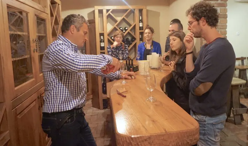 a group of people at a wine tasting 