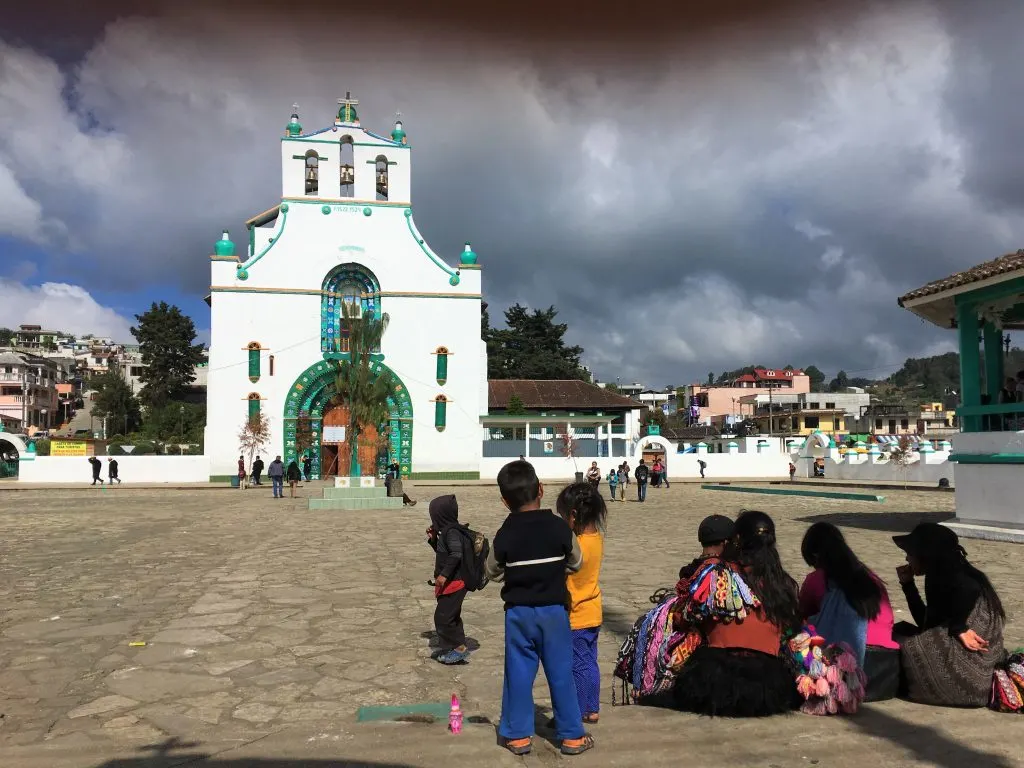 A square with children and a church in San Juan Chamula