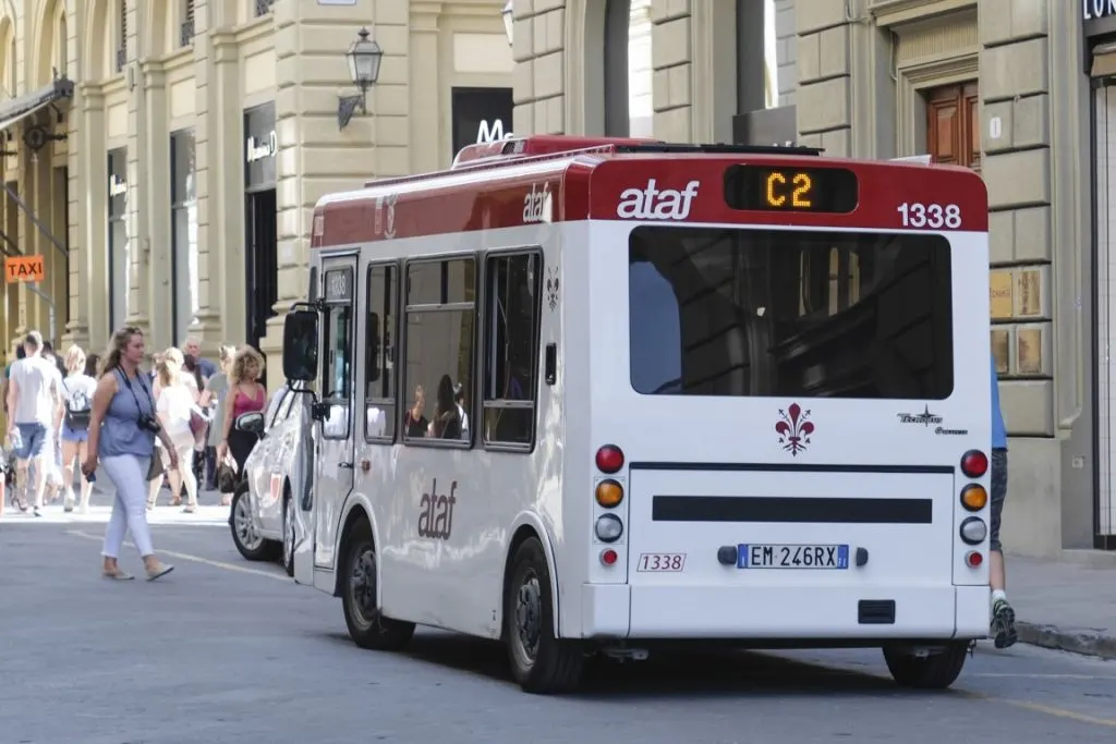 A white and red Ataf bus in Florence, inserted in a post about 2 days in Florence itinerary