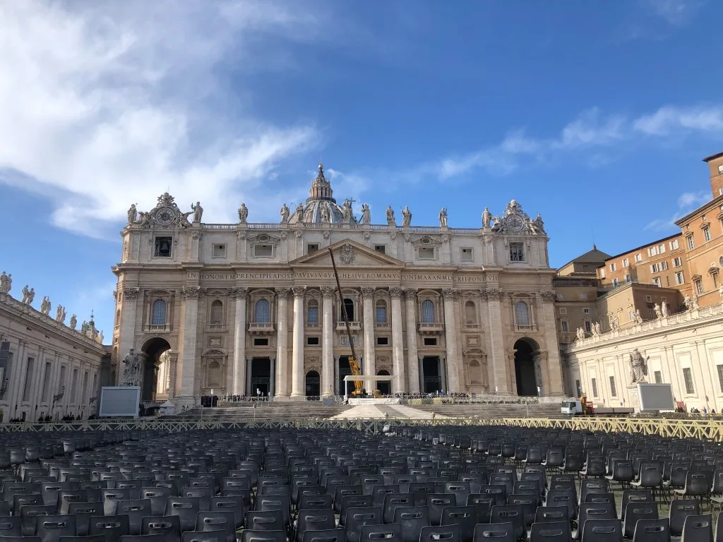 St Peter's Cathedral in Rome, with plastic chairs lined in front of it 