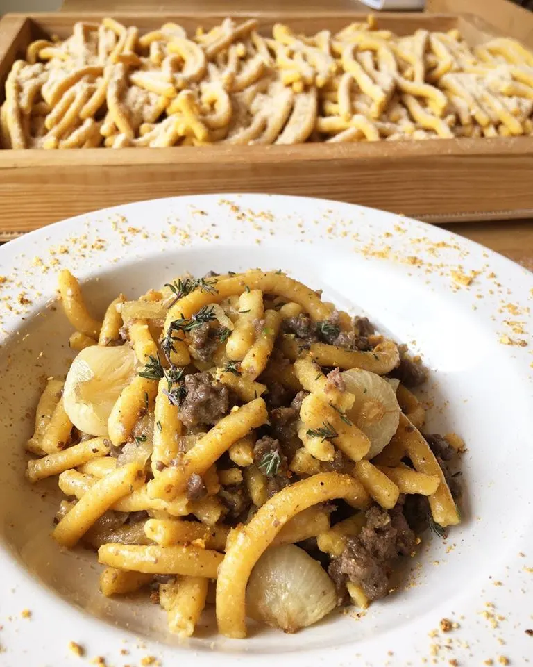 A dish of pici pasta, inserted in a post about Bologna restaurants