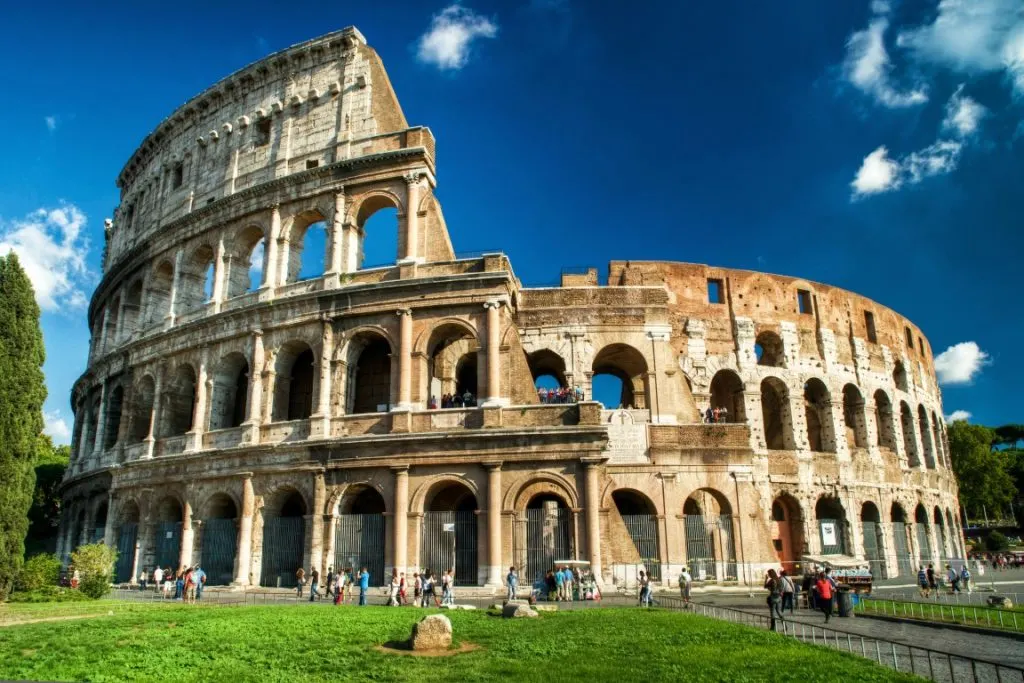 The Roman Colosseum, with blue skies in the background 