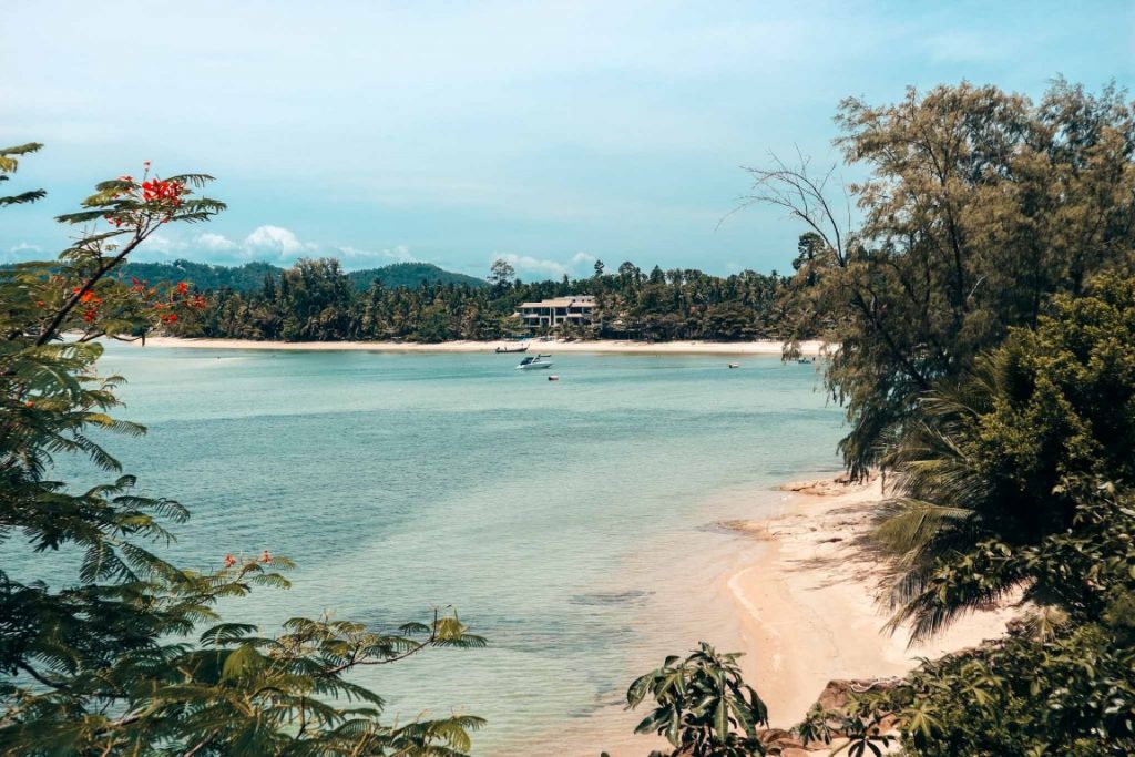 A beach in Thailand surrounded by vegetation