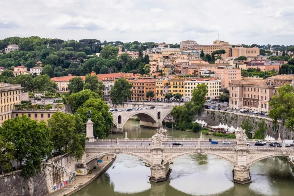 The river Tiber, crossed by Ponte Sant'Angelo and Ponte Umberto, with the center of Rome in the distance, seen from Castel Sant'Angelo