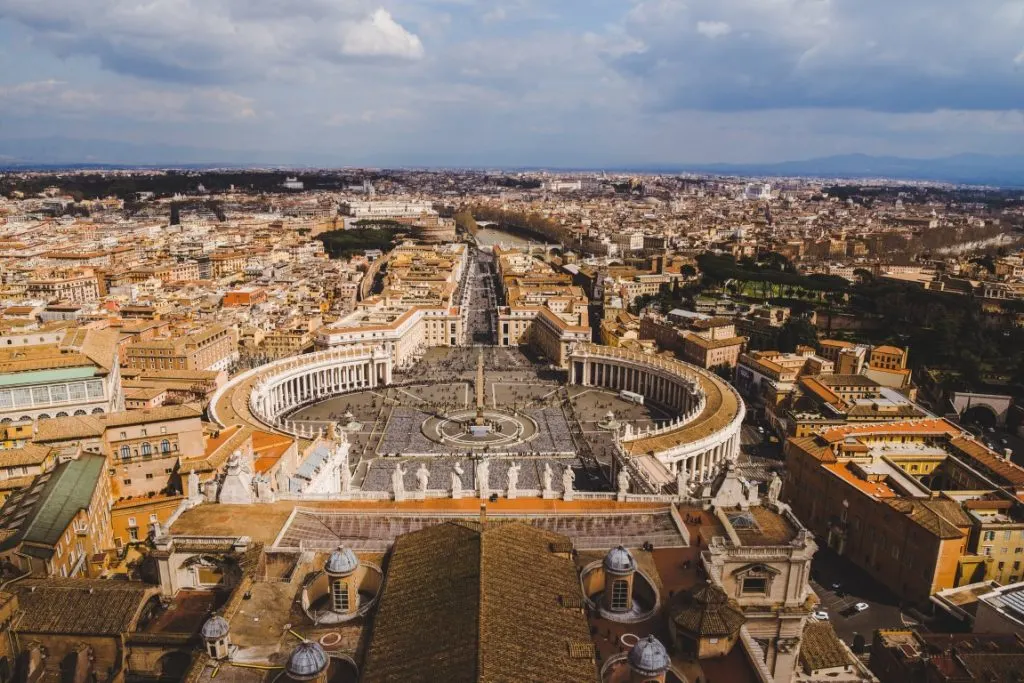 Image of Piazza San Pietro, the Obelisk, and Rome in the distance, seen from St. Peter's Dome