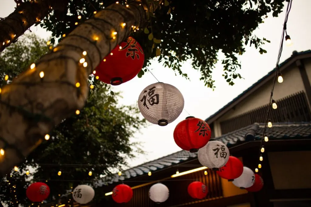 chinese paper lanterns hanging from a building