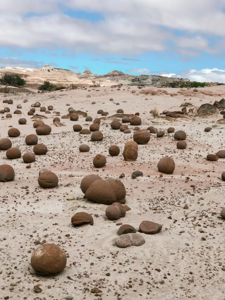 A sandy landscape dotted with circular rocks