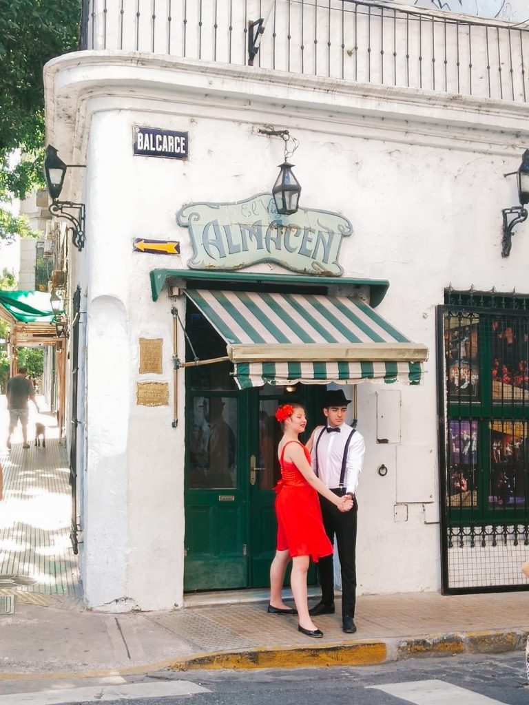 A couple dancing tango on the street