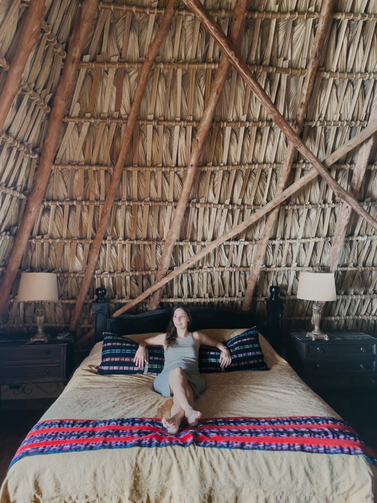 A woman relaxing on a double bed