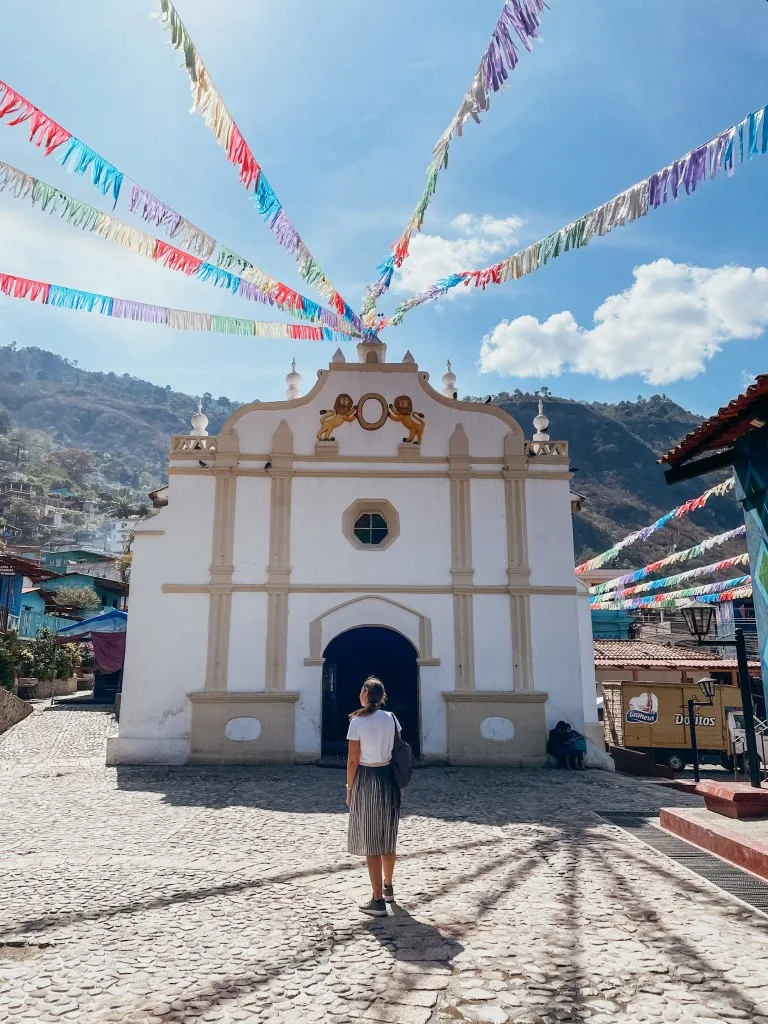 A woman standing outside a church