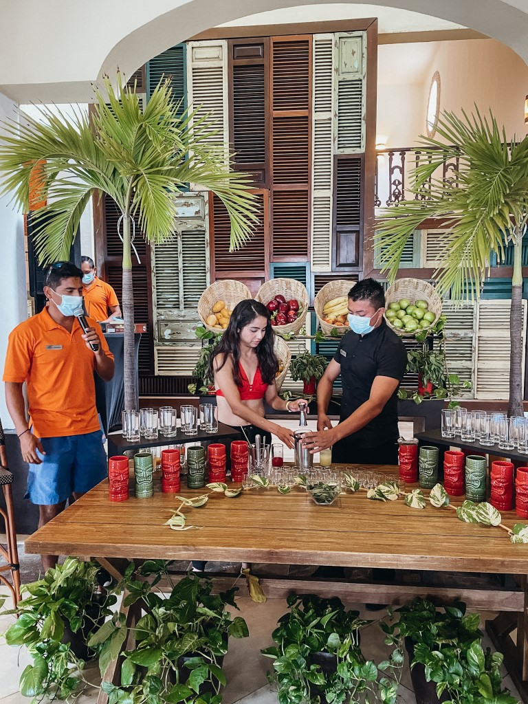 Two people making a demonstration during a juicing class 