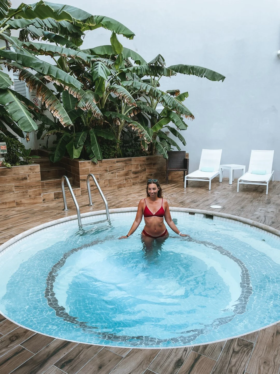 A woman relaxing in a hot tub at  Wyndham Alltra Cancun