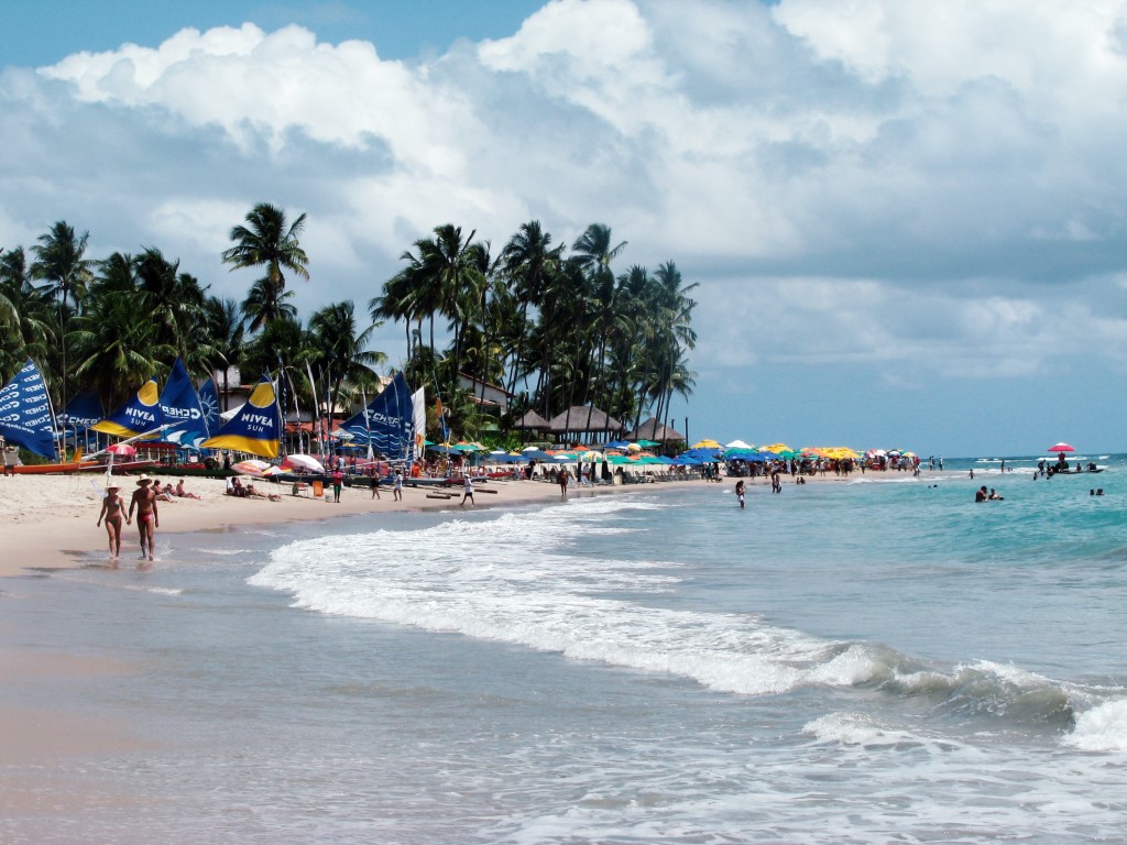 A populated beach on a cloudy day in Porto de Galinhas