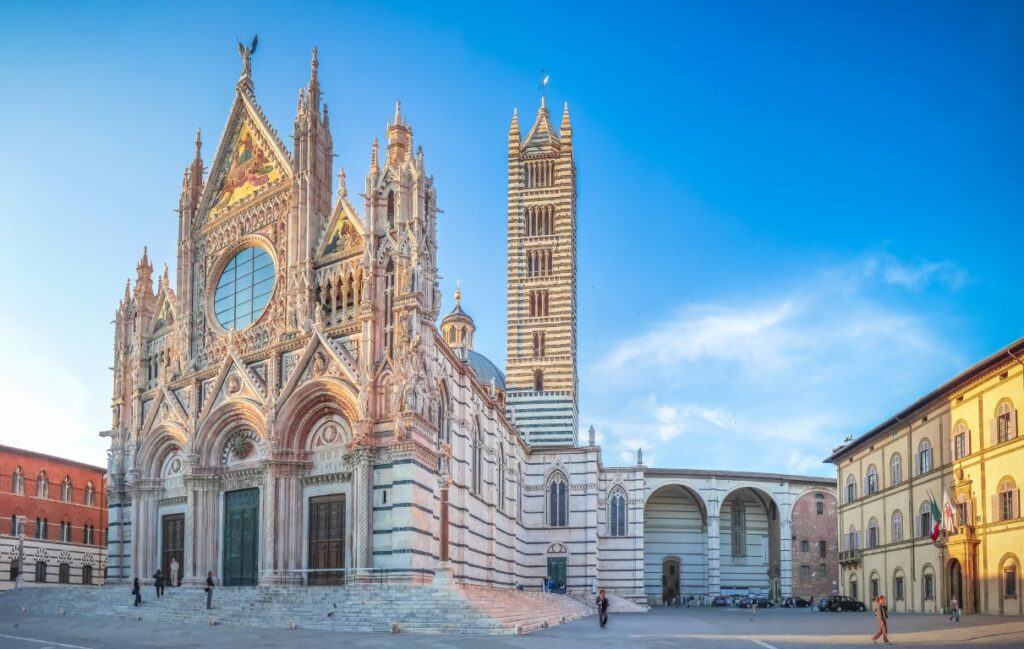 image of the Duomo di Siena, with clear blue skies in the background