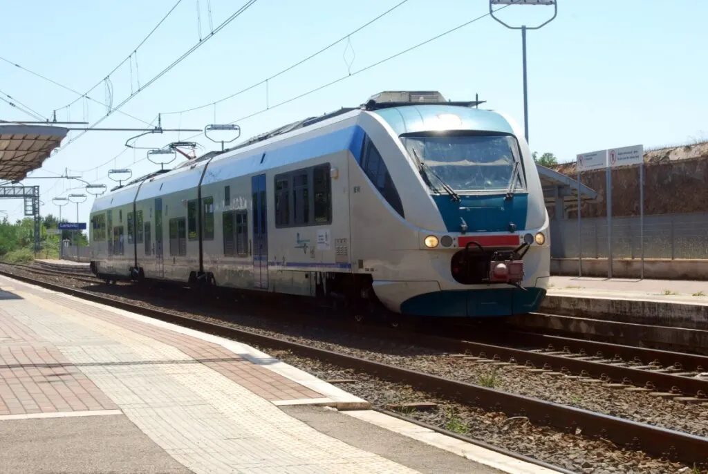 Image of a gray train on the train tracks,  the best way to travel on a day trip to Florence from Rome  