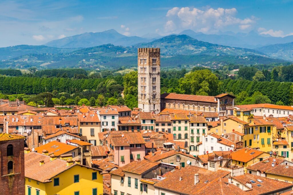 The enchanting town of Lucca, with the houses' terracotta roofs, and the mountains in the background