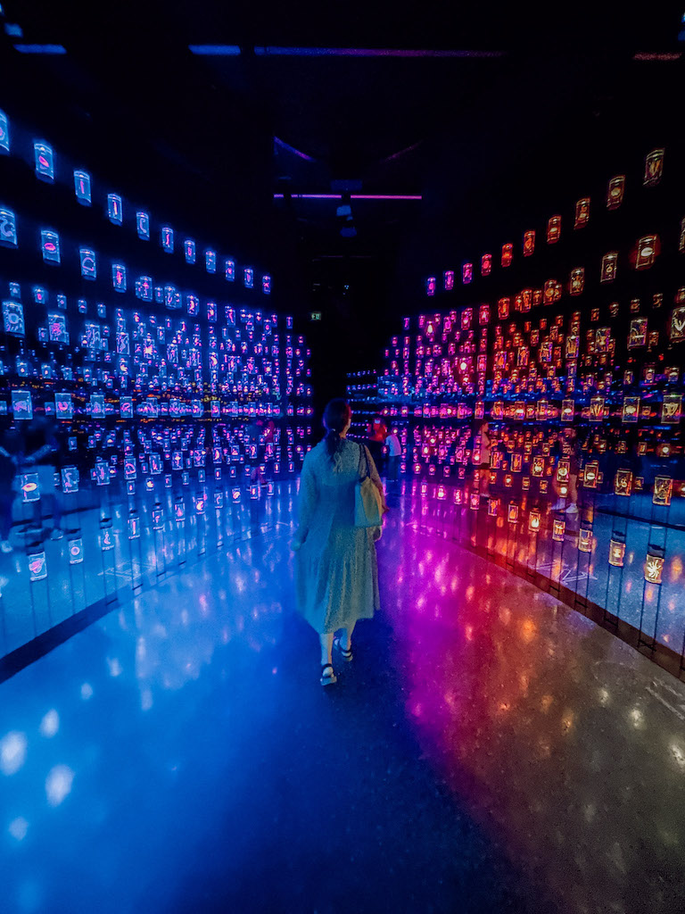 A woman exploring the exhibits in a futuristic museum