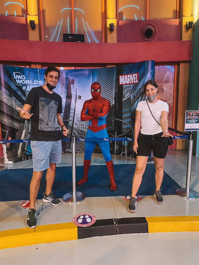 A couple posing with Spider Man at IMG Worlds of Adventure theme park