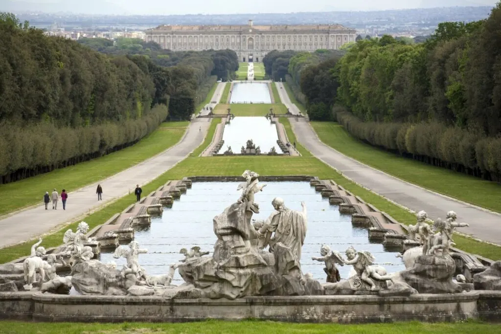 The Caserta Royal Palace seen in the distance, with the three garden fountains in the foreground of the image