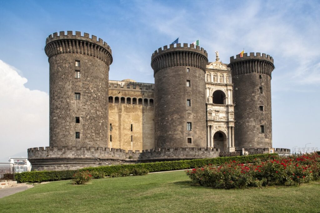 An image of Castel Nuovo with a garden in front of it, inserted in a post about things to do in Naples