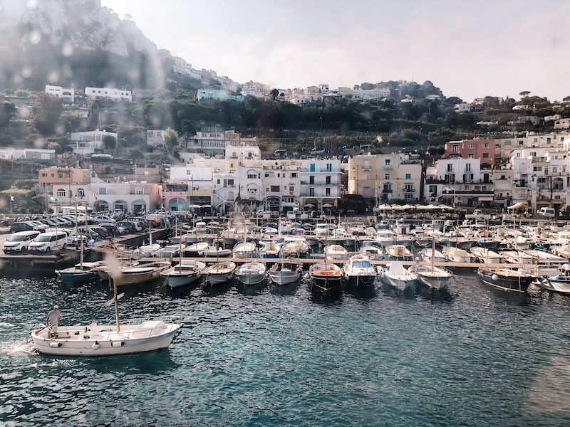 A boat in front of Capri Port. Image inserted in a post about the best Capri boat tours from Sorrento.