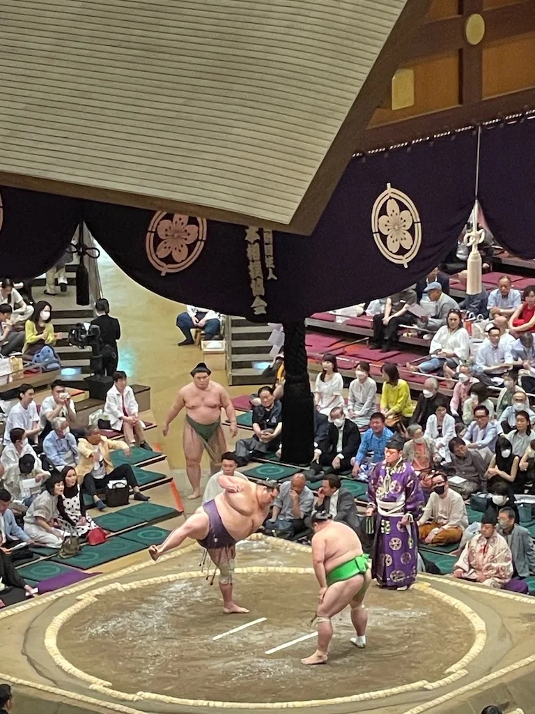 Two sumo wrestlers on stage