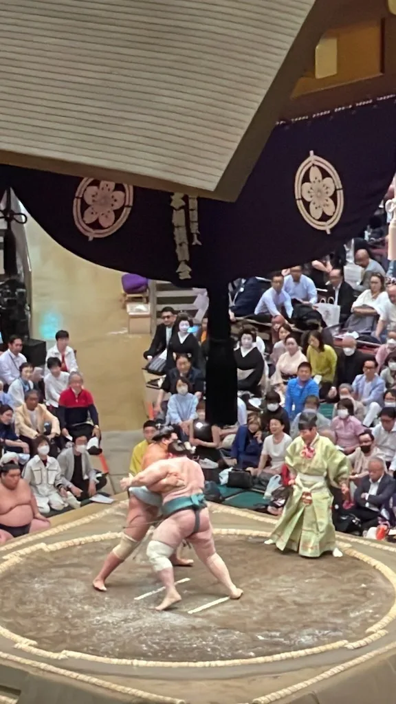 Two Sumo wrestlers on stage