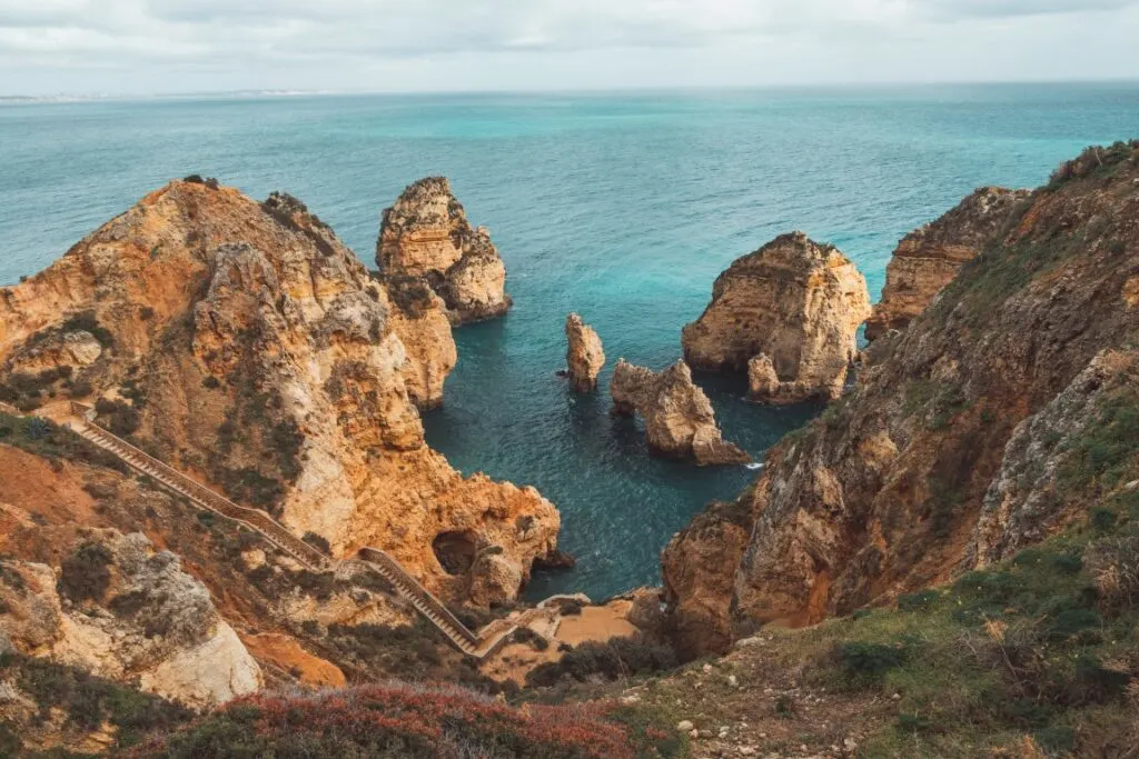 An image of Ponta da Piedade, one of the landmarks of the Algarve region with rocky outcrops towering over the Atlantic Ocean 