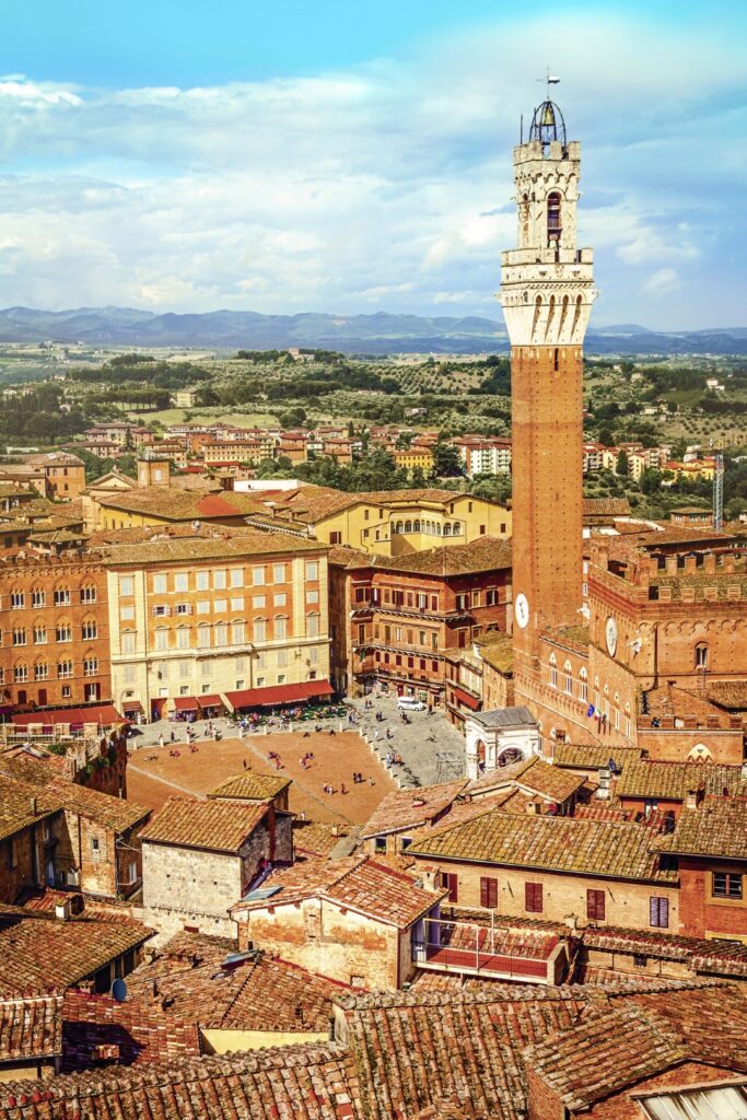 Image of the historic city of Siena, with its bell tower standing out