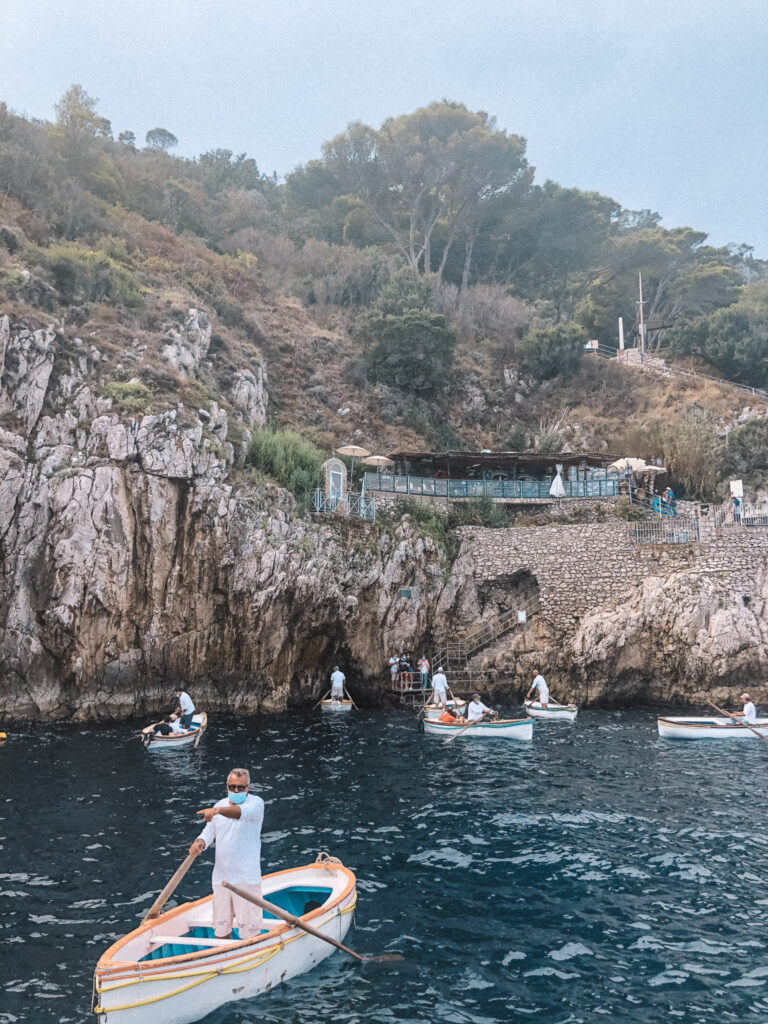 Rowing boats outside the Blue Grotto