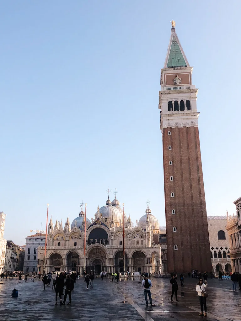 Image of St Mark's Bell Tower in Venice, with the Basilica in the background