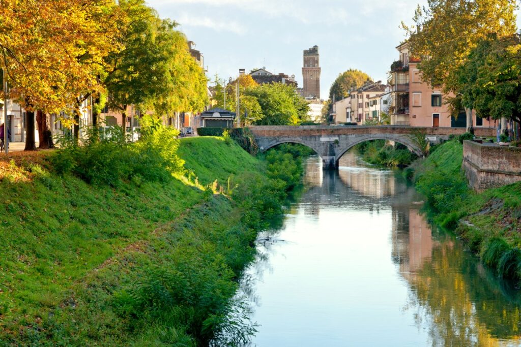 View of a bridge spanning across the Brenta River, one of the best places in Padua