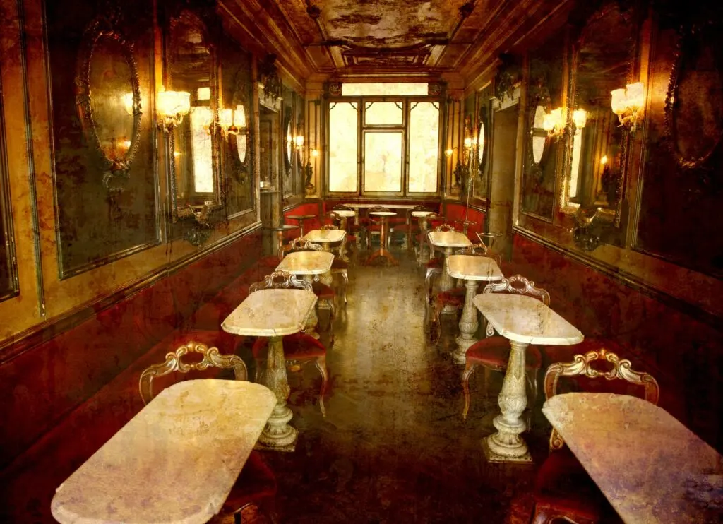 Interior of Caffè Florian in Venice, an 18th-century café with classical-looking furniture and decorations