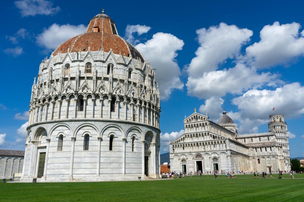 Image of the Pisa Baptistery in Piazza dei Miracoli, with the Cathedral and the Leaning Tower in the back