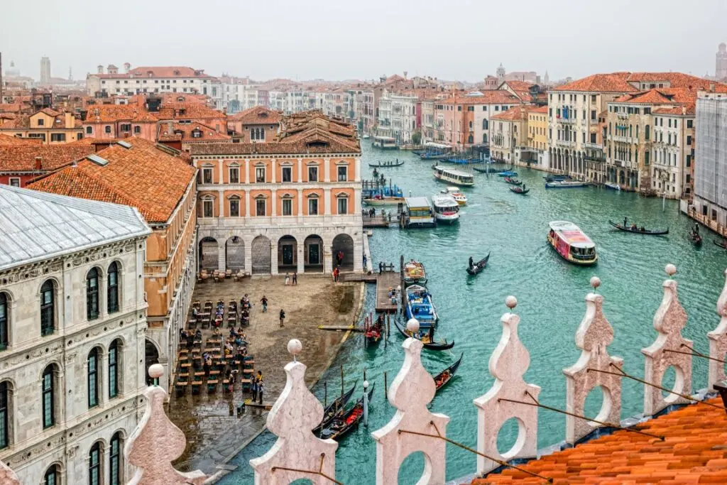 A vista of the Grand Canal and buildings in Venice, seen from  T Fondaco dei Tedeschi