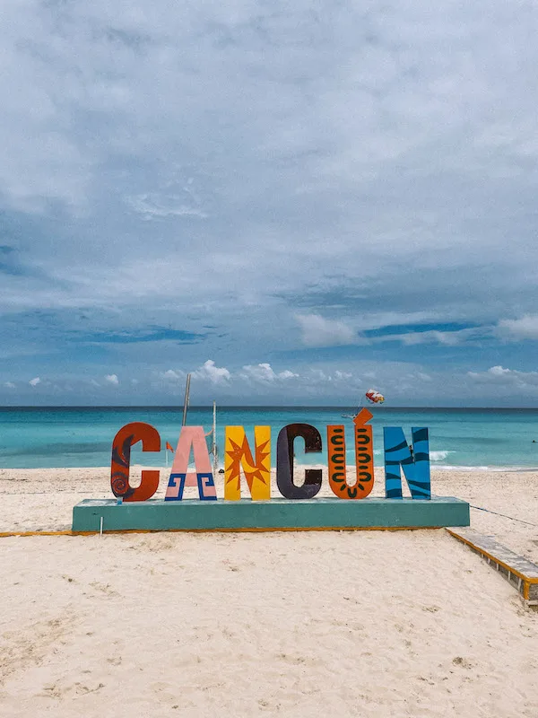 Colorful Cancun sign on a beach 