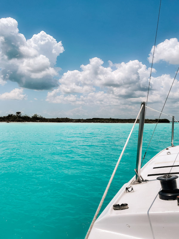 A catamaran in the blue waters of Bacalar.