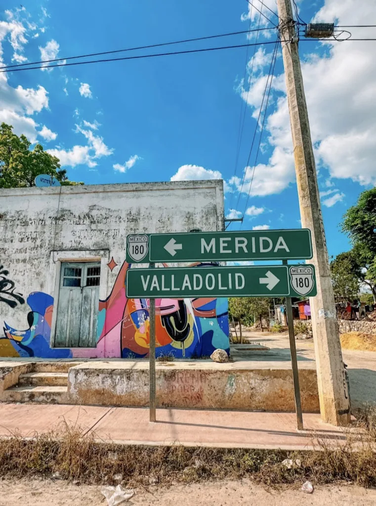 Road signs indicating directions to Merida and Valladolid from Cancun.