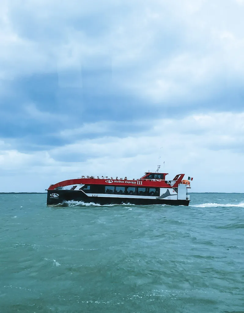 Black, red and white Holbox Express ferry from Chiquila to Holbox Island.