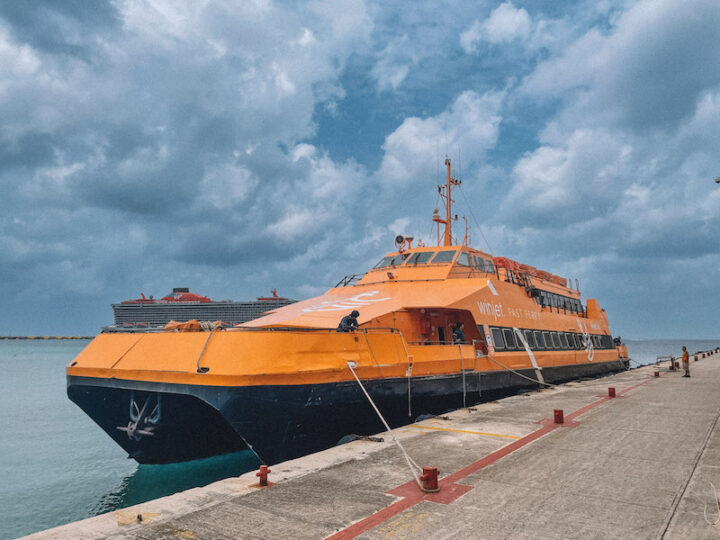 Orange Winjet ferry docked in Cozumel Port after cruising from Playa del Carmen to Cozumel.