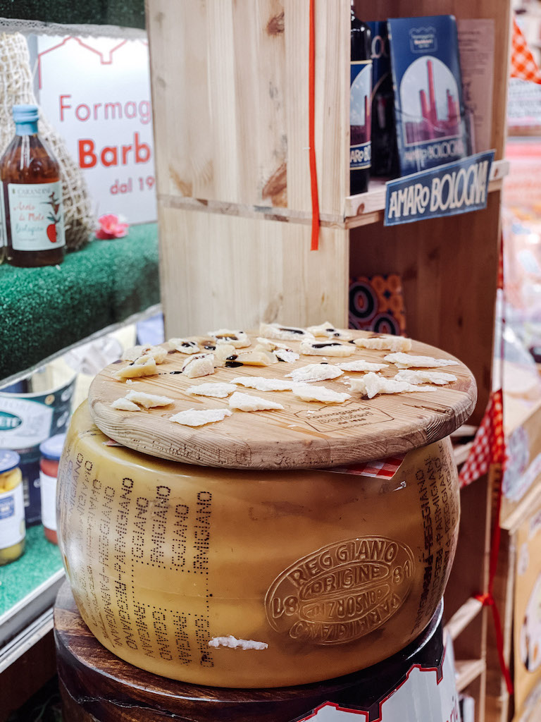 a wooden board with cheese samples on it