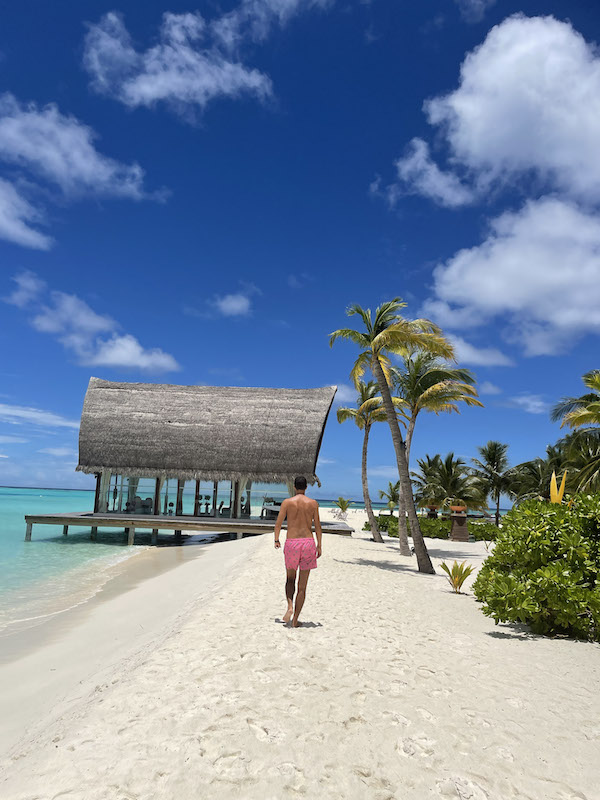 A man walking along the beach 