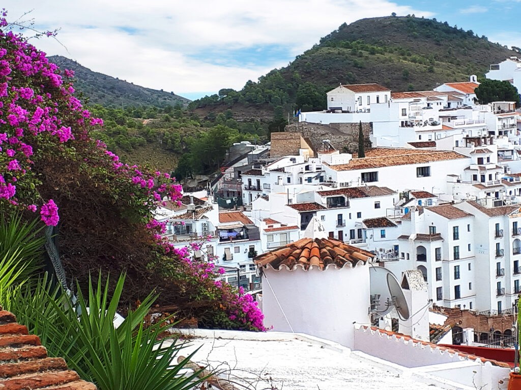 View of a white-washed town perched on a hill near Malaga.