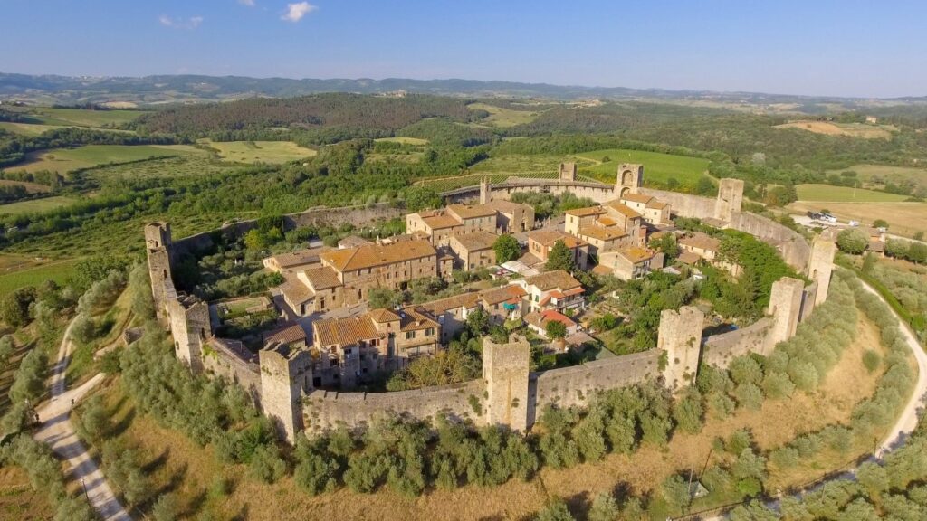 An aerial image of Monteriggioni, a Tuscan town completely enclosed by defensive walls and towers