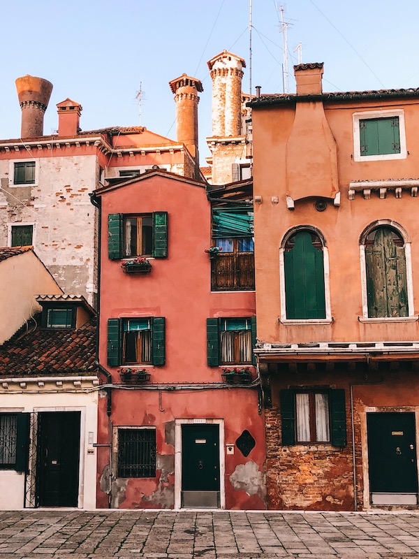 Terracotta-colored house facades in Venice