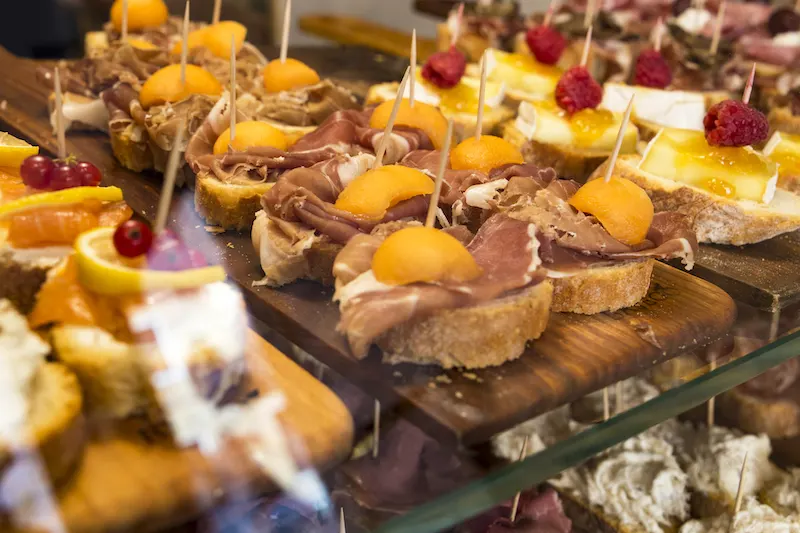 A wooden board full of cicchetti, Venetian tapas