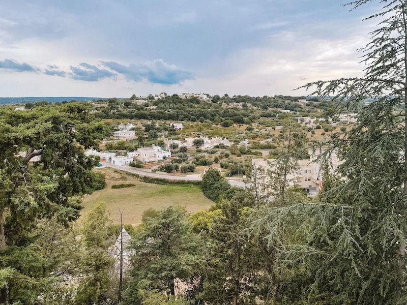 Views of the countryside with a few white houses dotting the green landscape