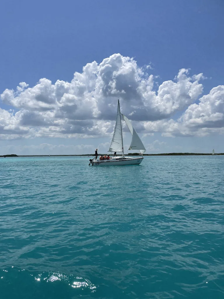 White sailing boat on the water.