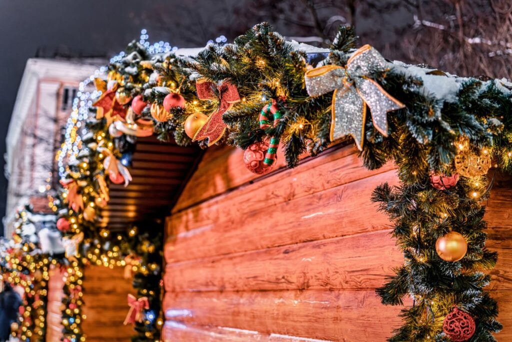 A closeup image on a wooden Christmas stall with colorful decorations